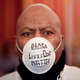 Hubert Roberson of Flint, Mich., wears a mask to a prayer service at the Metropolitan Baptist Tabernacle Church in Flint before participating in a national mile-long march to highlight the push for clean water in the city on Feb. 19, 2016.
Bill Pugliano/Getty Images